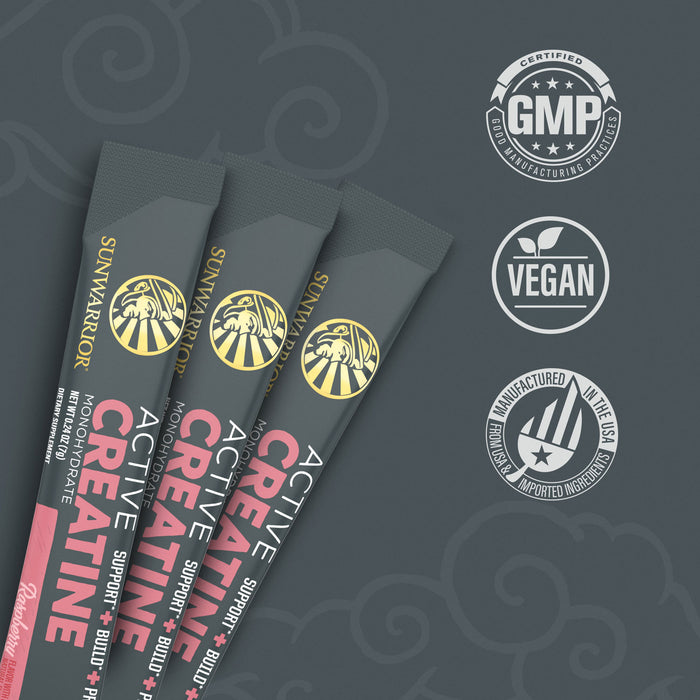 Three gray Sunwarrior Active Creatine stick packs with raspberry flavor and quality certification icons