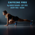 Athletic woman in black workout clothes performing a low lunge stretch on a dark floor under text highlighting caffeine free, zero added sugars, soy free, dairy free, and vegan attributes.