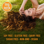 Woman lying on grass with long hair spread out and wellness claims displayed on image