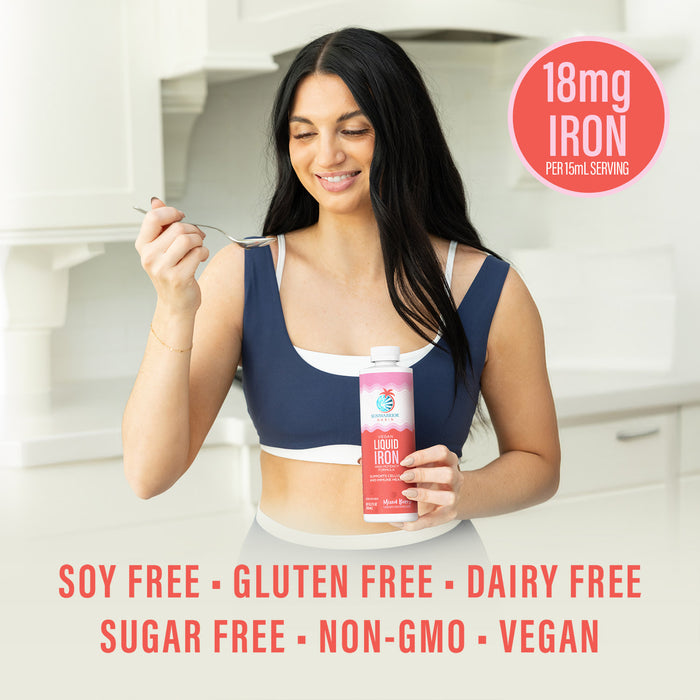 Woman holding a spoon in one hand, and a bottle of Sunwarrior Oasis Liquid Iron in the other. Badge saying 18mg of Iron per 15ml Serving. Words across the bottom: Soy Free, Gluten Free, Dairy Free, Sugar Free, Non-GMO, Vegan