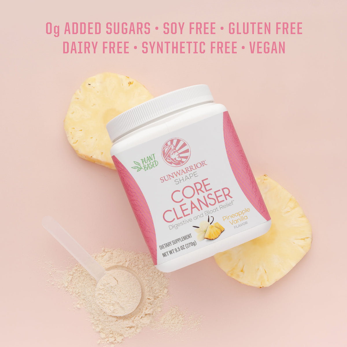 Container of Sunwarrior Core Cleanser with pineapple slices and powder scoop on pink background