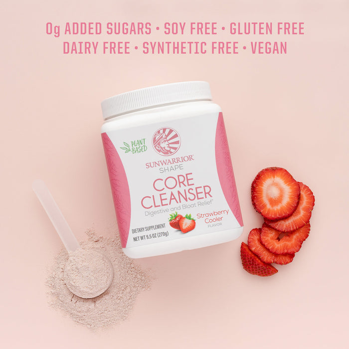 Container of plant-based strawberry-flavored core cleanser with powder scoop and sliced strawberries on pink background