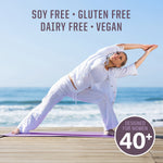 Woman in white doing yoga stretch on beach with text about soy, gluten, dairy free and vegan options