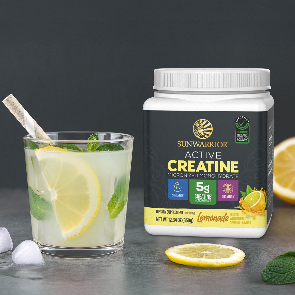 Sunwarrior Active Creatine container beside lemonade drink with lemon slice and mint leaves.