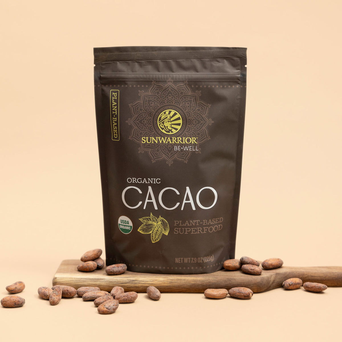 Sunwarrior Organic Cacao package on a beige background with cacao beans around