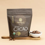 Sunwarrior Organic Cacao package on a beige background with a bowl of cacao beans.