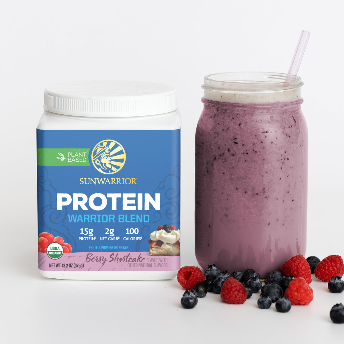 Sunwarrior Warrior Blend berry shortcake plant-based protein powder with a purple smoothie and berries
