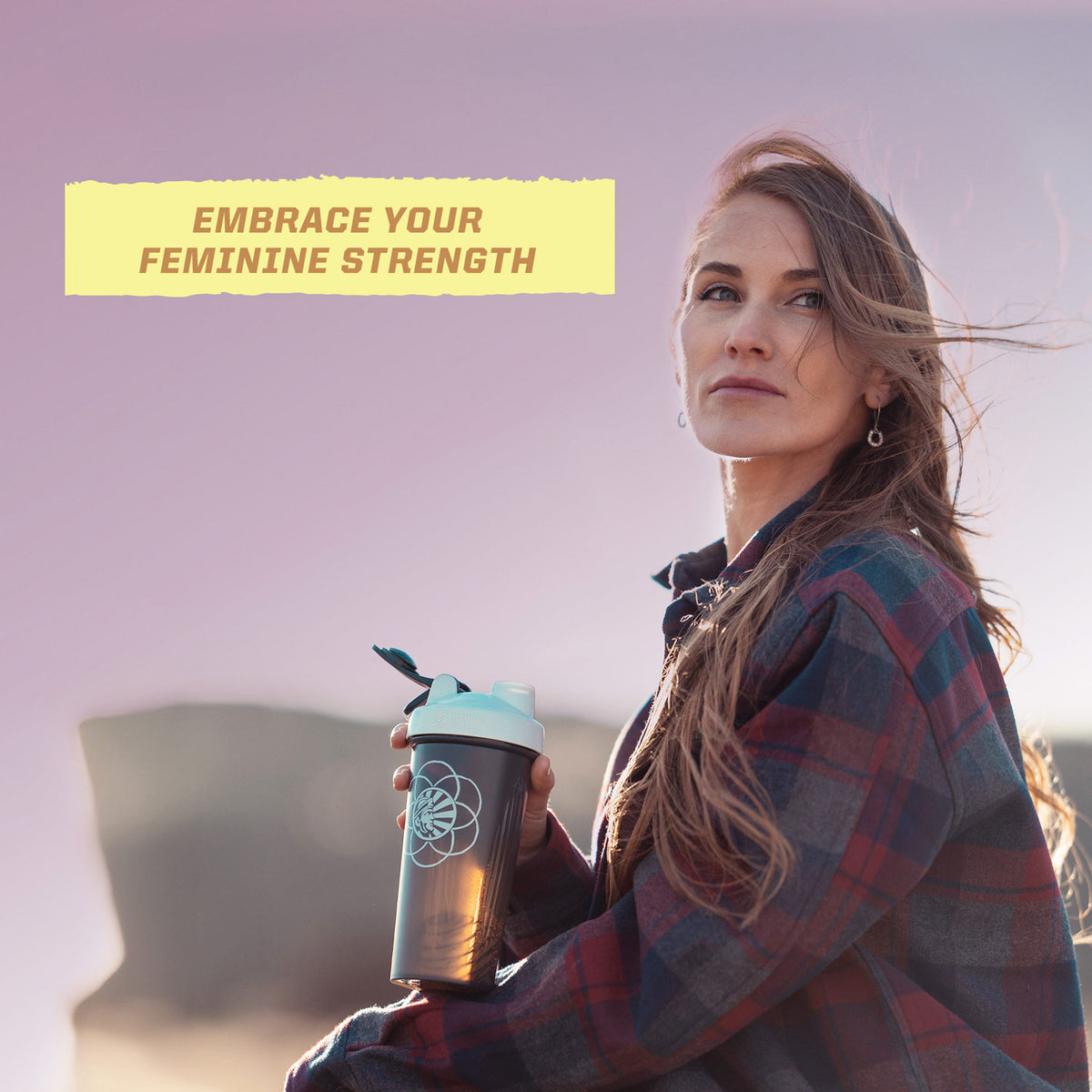 Woman outdoors at sunset holding a drink bottle with text 