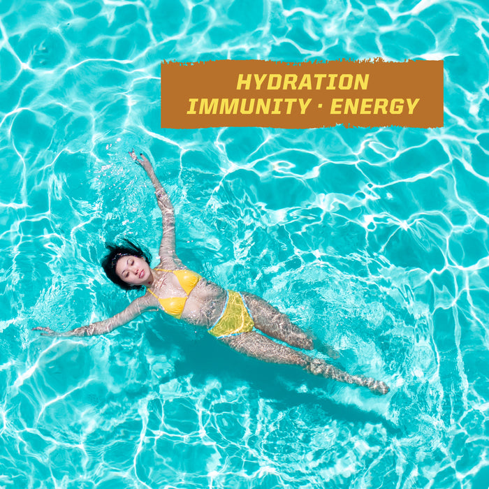 Woman in yellow bikini floating relaxed in a bright blue swimming pool with hydration immunity energy text above