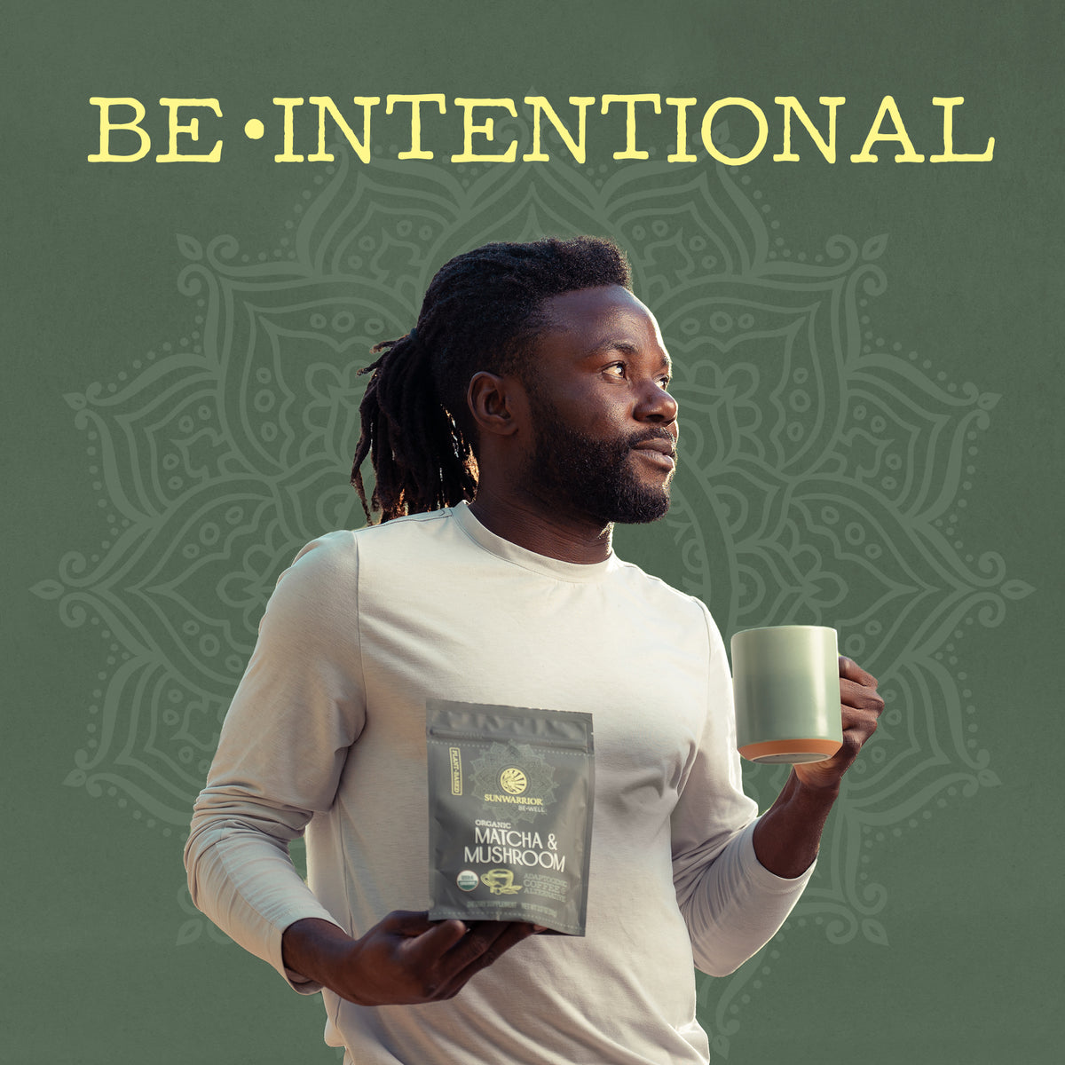 Man holding a matcha and mushroom wellness powder packet and green mug against mandala background