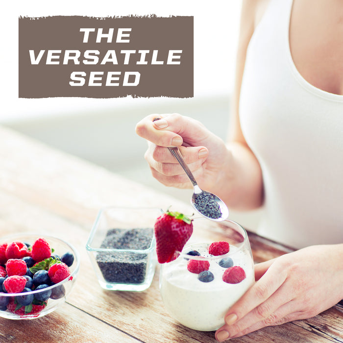 Person holding spoon with chia seeds over yogurt topped with berries and a bowl of mixed berries nearby