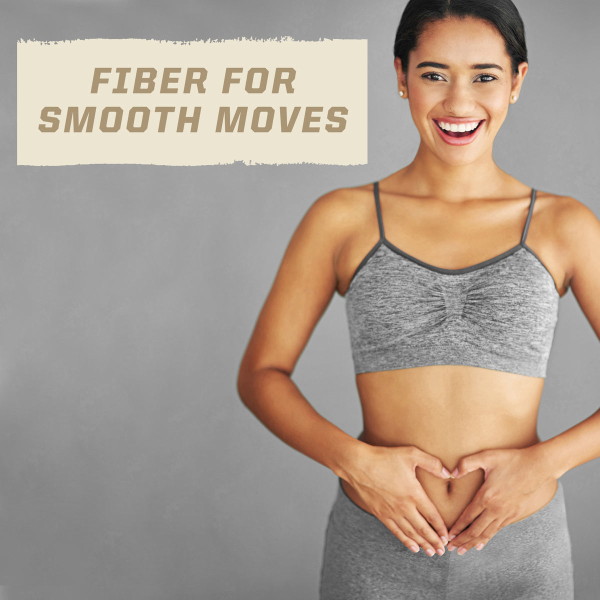Smiling woman in gray workout clothes making a heart shape on her stomach beside fiber for smooth moves text