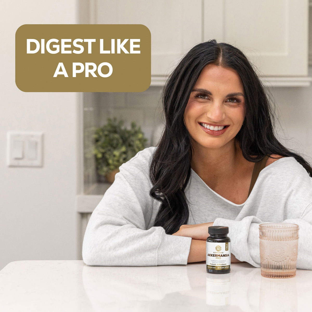 Woman smiling at a table with a bottle of supplement and a glass, text reads Digest like a pro