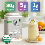 Container of Sunwarrior organic active protein powder beside a creamy cake batter smoothie and cupcake with sprinkles