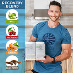 Man in blue shirt holding two containers of plant-based protein powder with recovery blend ingredients listed.