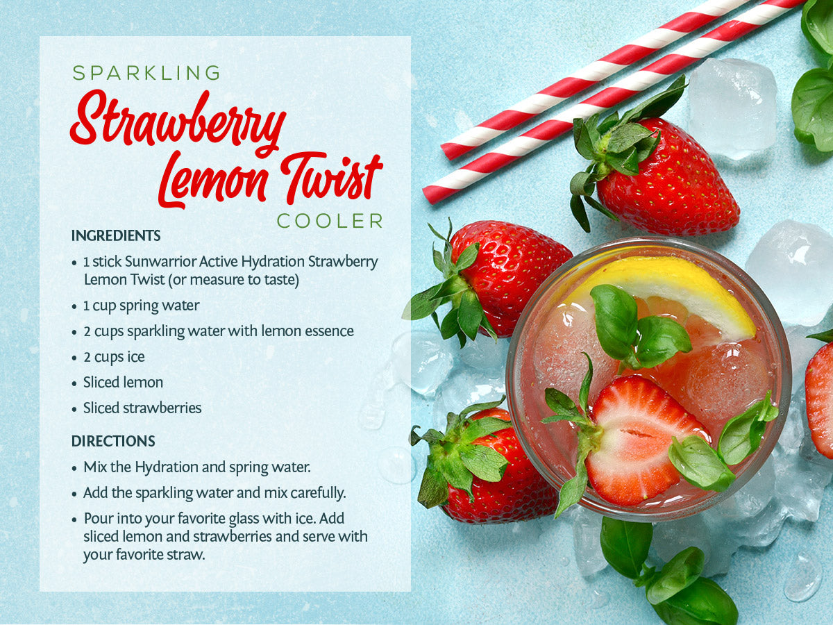Glass of sparkling strawberry lemon drink with fresh strawberries, lemon slices, and striped straws on blue surface