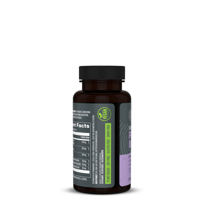 Dark brown bottle with black cap showing a side label listing vegan and plant-based dietary information, including soy-free, gluten-free, and dairy-free claims, on a white background.