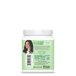 Back label of a plant-based wellness supplement with ingredient and mission details on light green background.