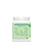 Container with green label detailing ingredients and benefits of a plant-based wellness powder blend.
