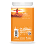Back view of orange plant-based protein powder container with wellness text and sunset yoga image
