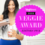 Woman pouring chocolate smoothie into glass next to bright pink VegNews 2025 Veggie Award badge